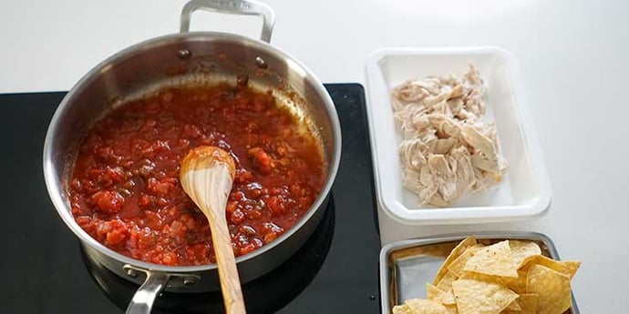 Saute and cook red salsa in hot oil in a stainless steel frypan